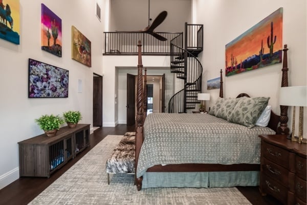 Custom bedroom with a spiral staircase and artistic décor by MGD Builders in Phoenix, AZ