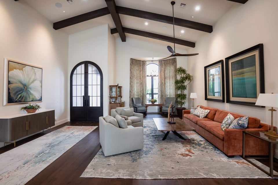 A bright and open living room with a modern and elegant design.