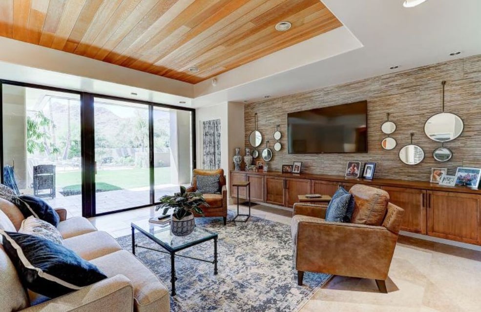 home addition in paradise valley arizona with floor to ceiling sliding doors, natural light, and custom wood ceiling