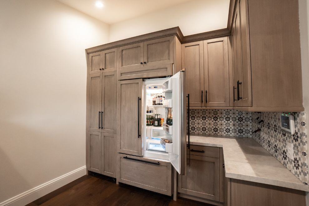 Custom pantry with matching fridge and cabinets