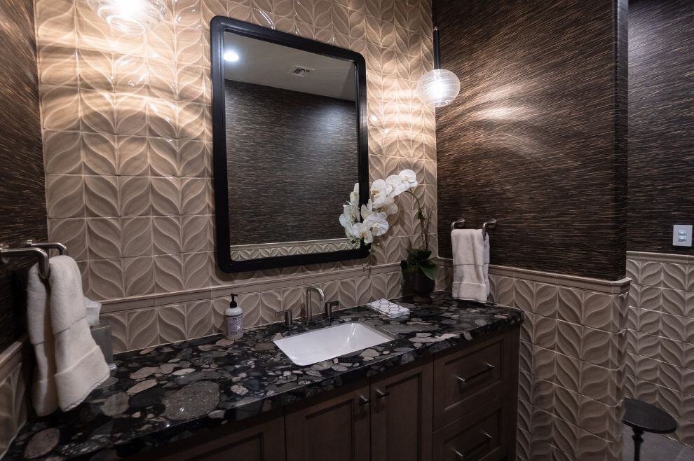 Dark bathroom remodel with textured wall