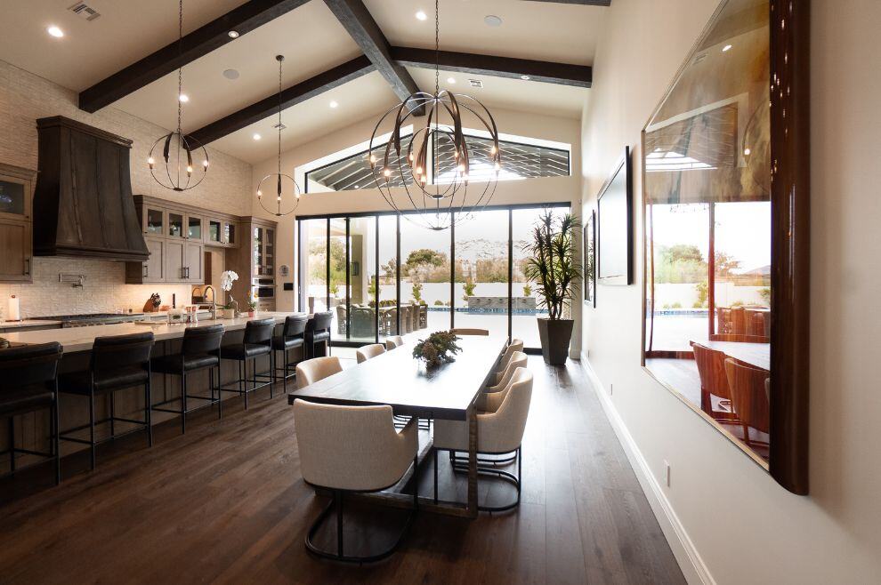 Open layout kitchen and dining area with wall to wall patio doors