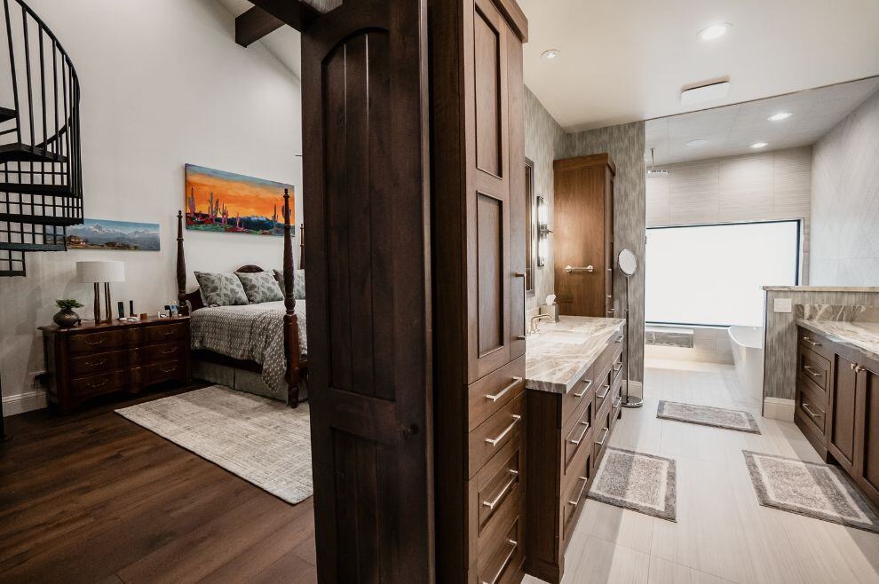 Bedroom and bathroom remodel with brown cabinets and spacious bathroom