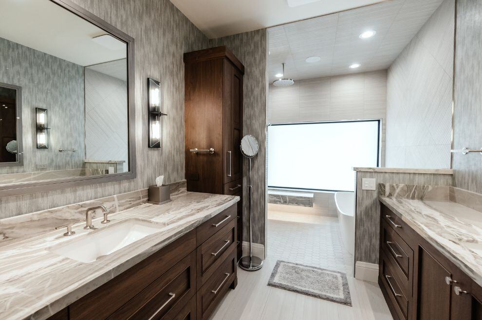 Large bathroom remodel with textured wallpaper and free standing tub