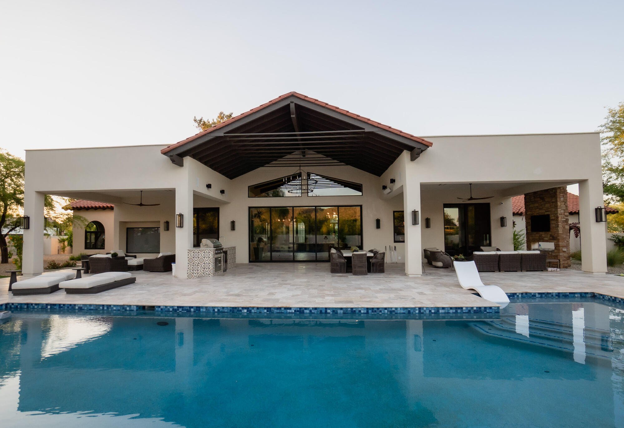 Backyard pool with a view of the custom home built by MGD Builders in Phoenix, AZ