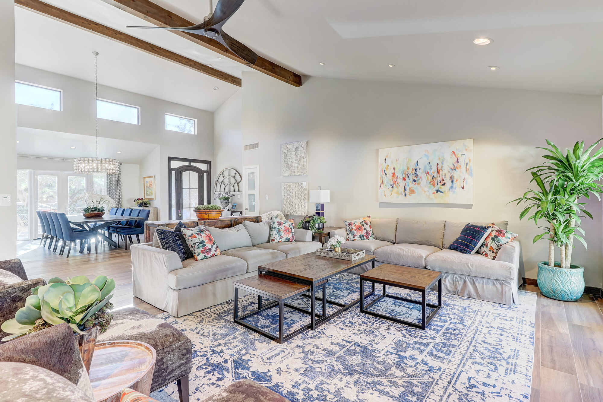 Living room with vaulted ceilings and modern furniture in a custom-built home by MGD Builders in Phoenix, AZ