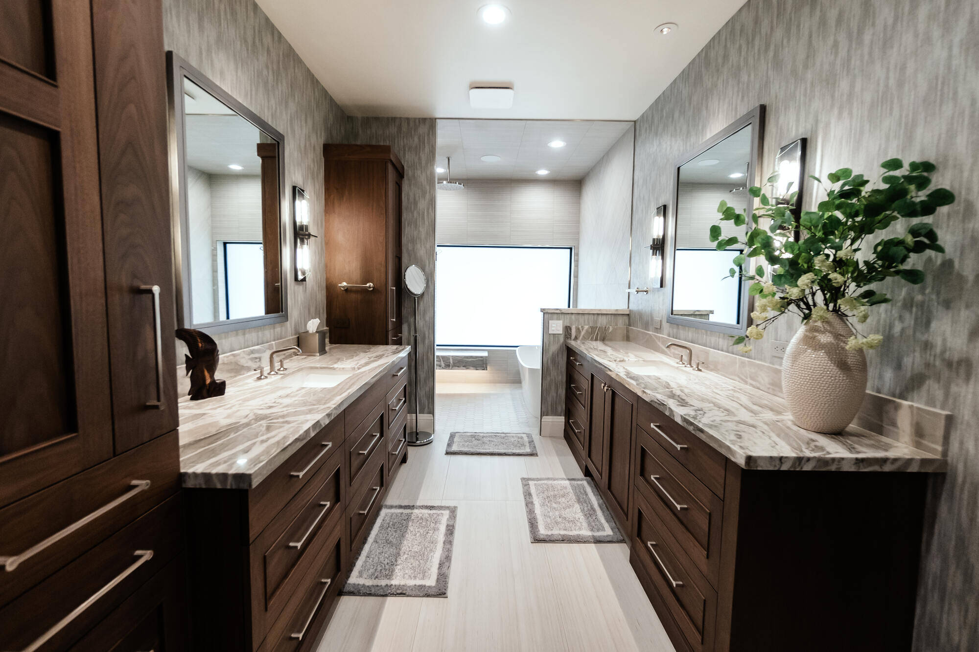 Luxurious bathroom with double vanities and marble countertops in a custom home by MGD Builders in Phoenix, AZ