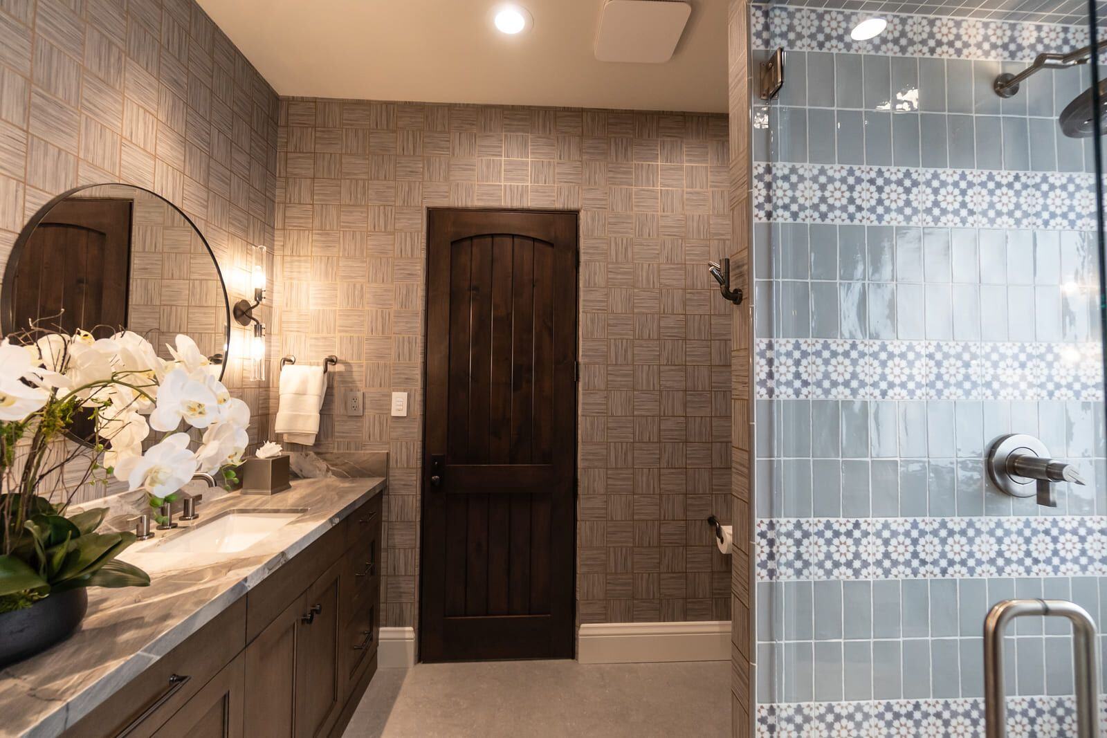 Luxurious bathroom featuring custom tiled shower and marble vanity, MGD Builders, Phoenix AZ 