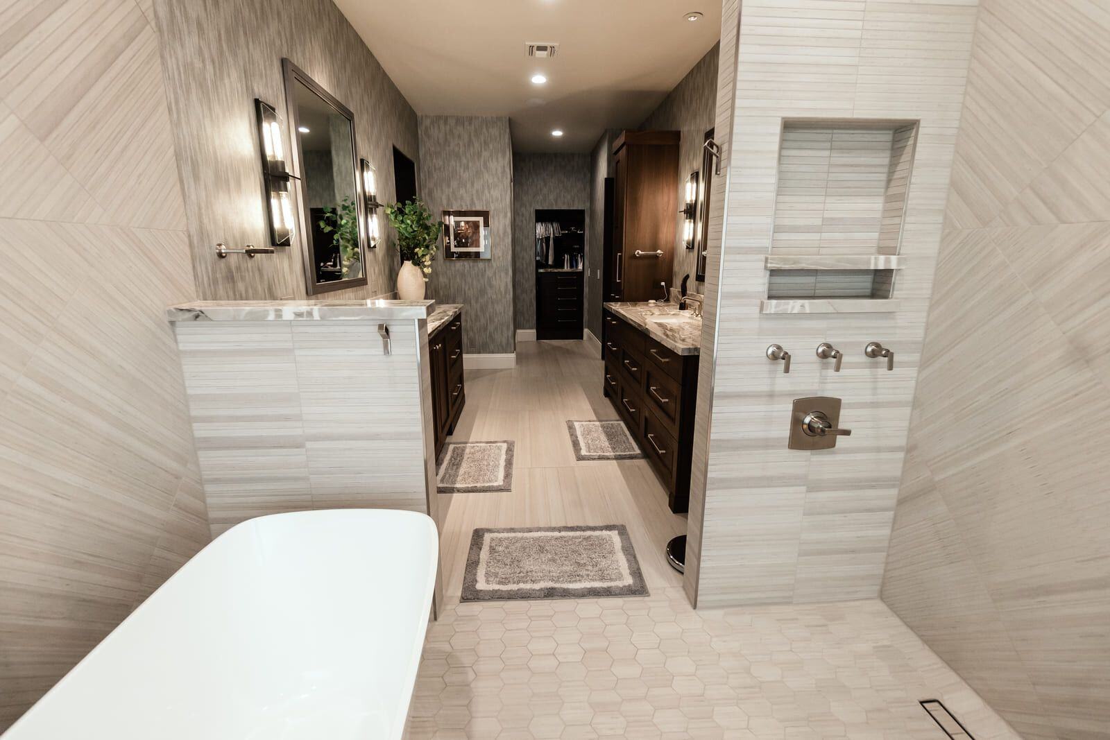 Modern bathroom design with built-in shower storage and marble countertops, Phoenix by MGD Builders 